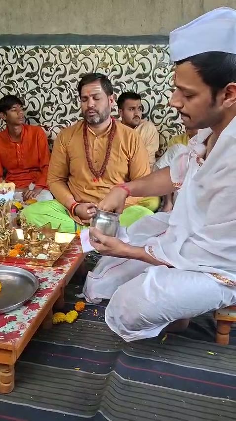 Devotees taking part in the sacred puja vidhi