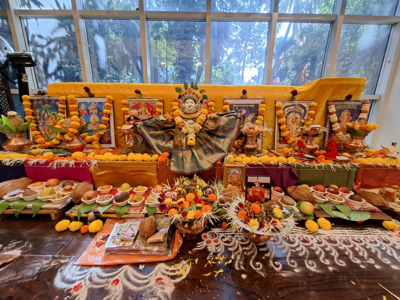 Traditional Devi puja altar adorned with marigolds and offerings